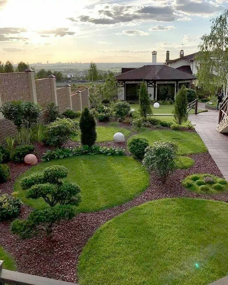 Layered garden border with trees, shrubs and perennials